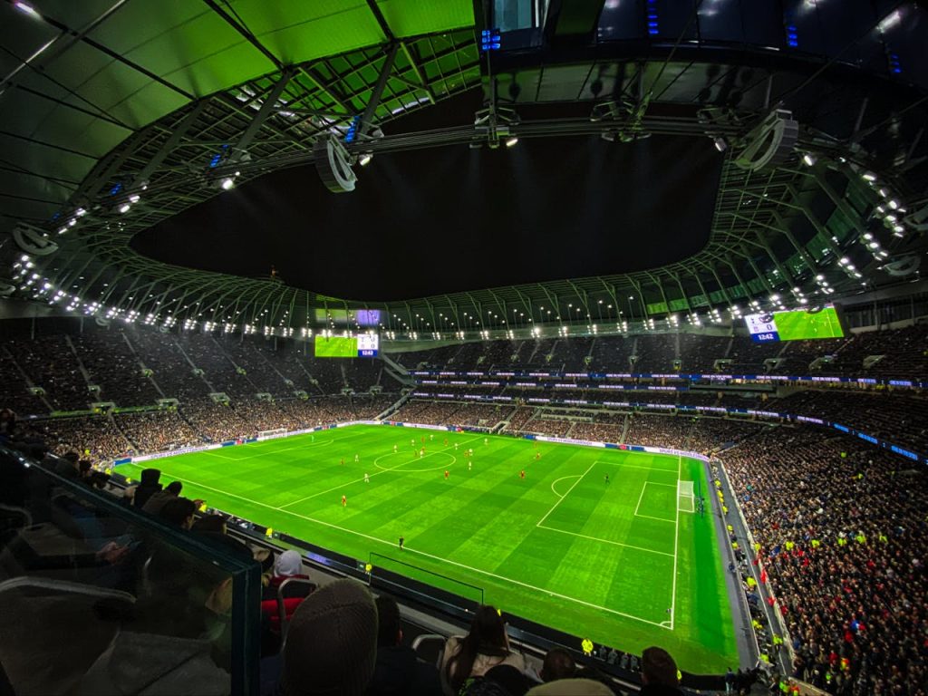 pexels photo 3991976 A captivating night football match at a packed stadium in England, showcasing dynamic gameplay and vibrant atmosphere.