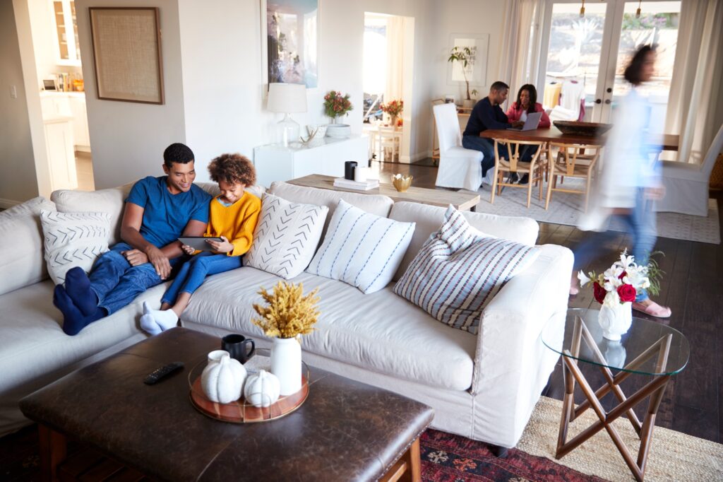 Three generation family family spending time in their open plan living room