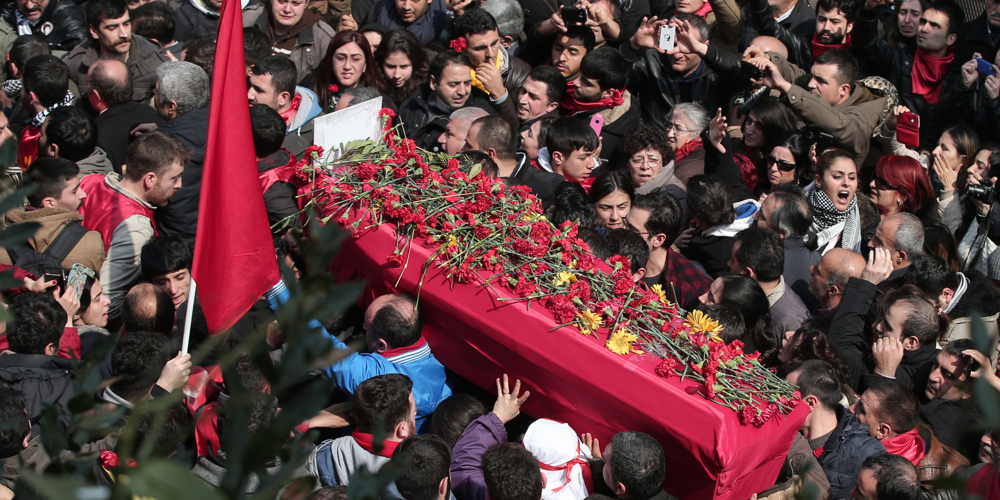 The people carry the coffin of Berkin Elvan, a Turkish teenager who was in a coma since being hit in the head by a tear gas canister fired by police during the summer's anti-government protests, during his funeral in Istanbul, Turkey, Wednesday, March 12, 2014. On Wednesday, thousands converged in front of a house of worship calling for Prime Minister Recep Tayyip Erdogan to resign.(AP Photo/Emrah Gurel)