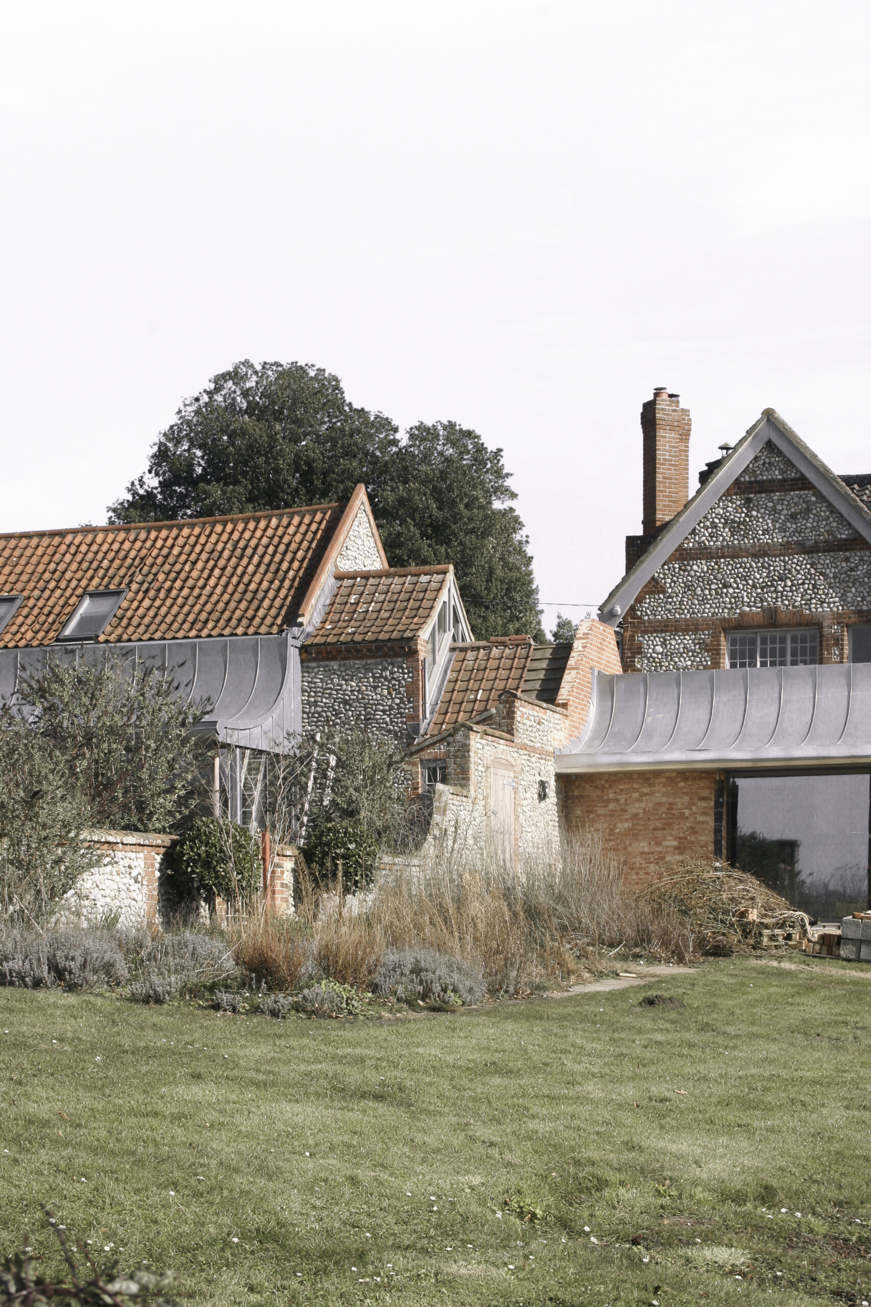 A view of Old Rectory Farm with phase 1 (stables) and phase 2 (kitchen) meeting Alexander Hills Architects