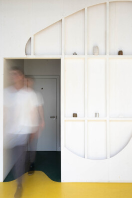 The AH A [Alexander Hills Archtiects] shape, the intuitively-cut form in the painted stud partition Alexander Hills Architects