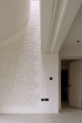 The view looking north showing the painted flint wall Alexander Hills Architects