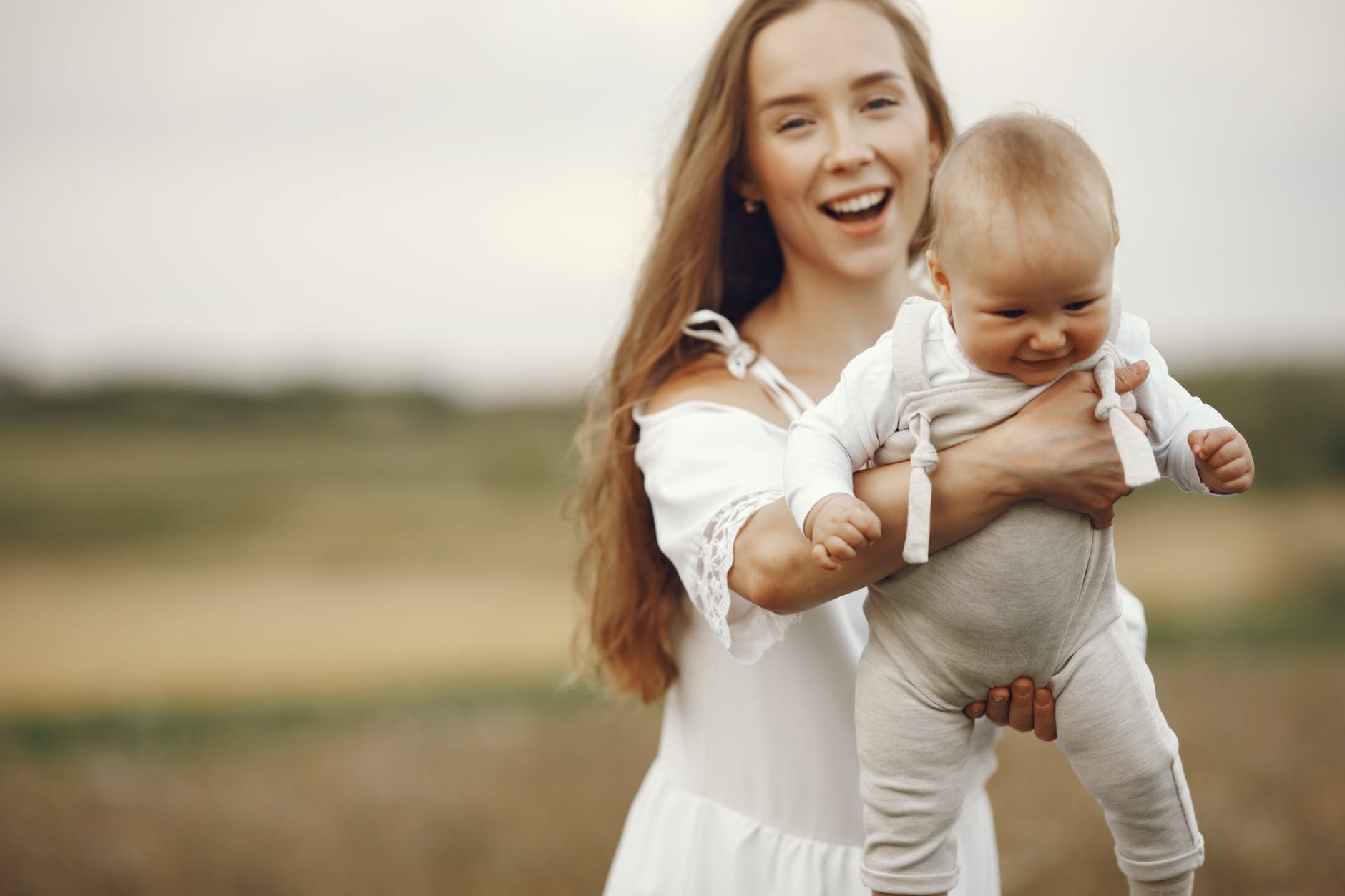 portrait of mother holding baby