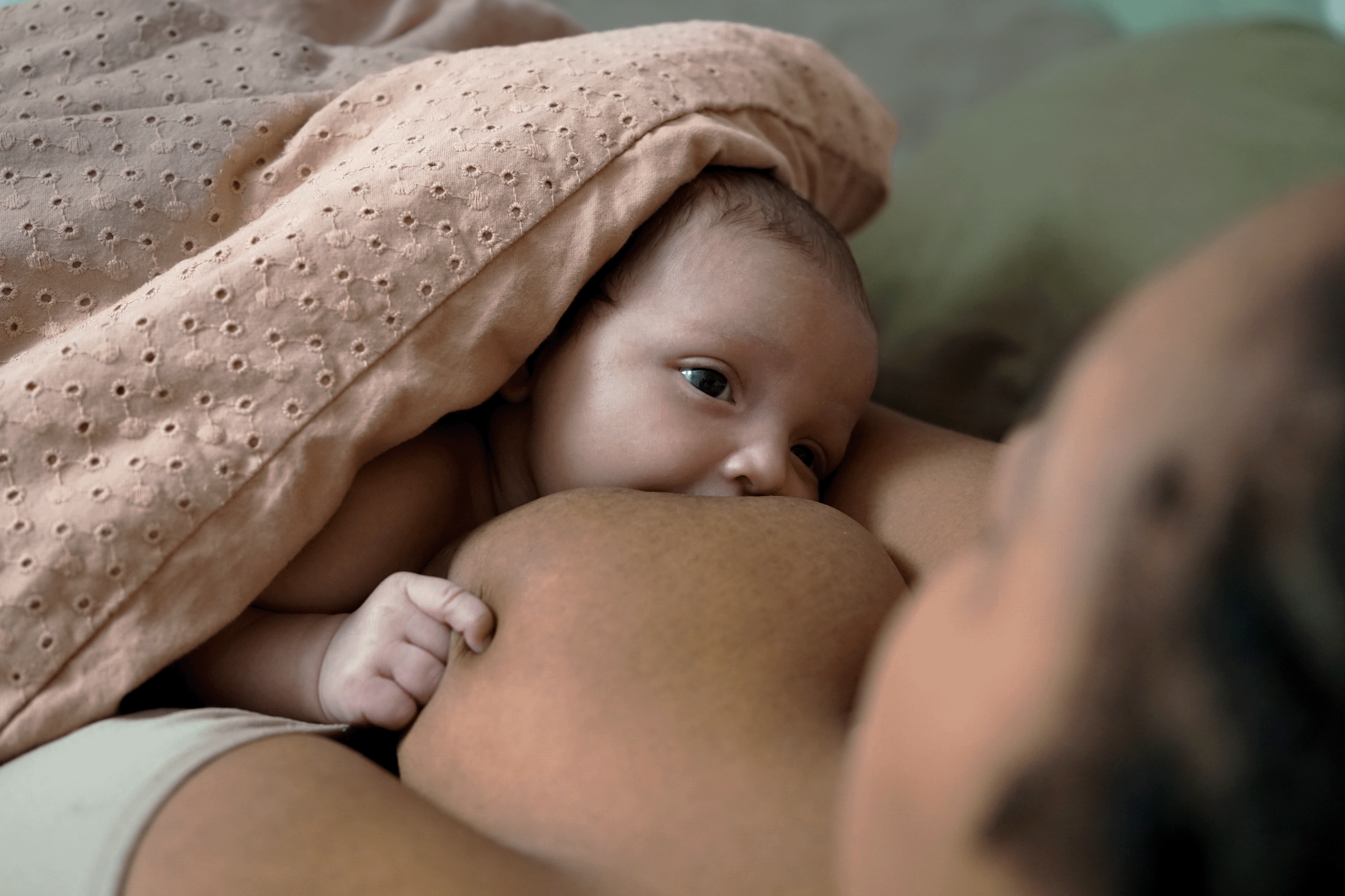 Portrait of mom and breastfeeding baby.