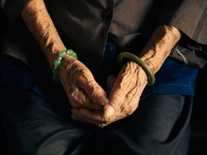 Sign, Cafe Cho-lon, elderly woman's hands, jewellery, aim-frame photography