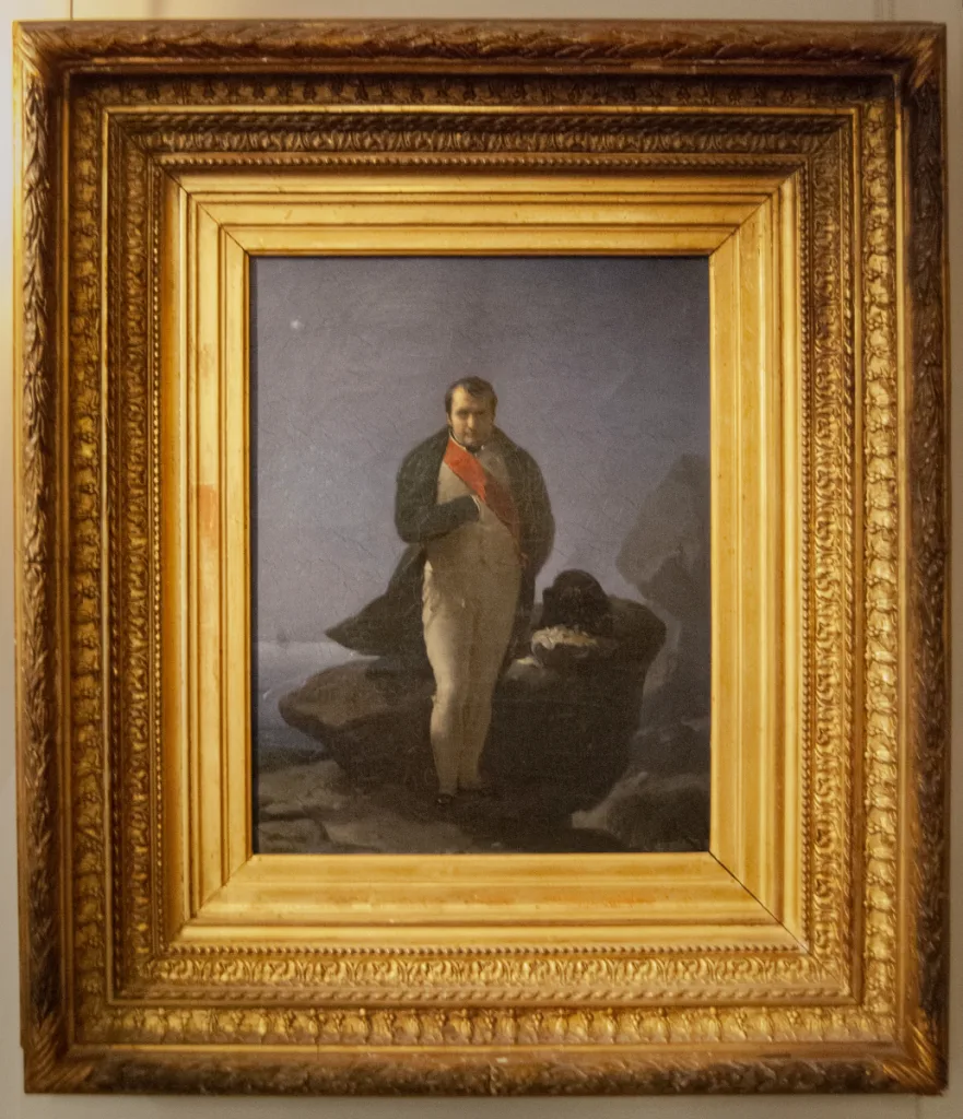 Photograph of the painting Napoléon dressé sur le rocher de Sainte Hélène (1824) by Jean Baptiste Mauzaisse from the Palace of Fontainebleau.