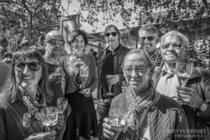 Black and white portrait of locals having a Brugse Zot beer in Brugge during the opening ceremony of the Triënnale, 2015
