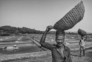 Black and white portrait of a salt pan worker in the salt fields of Gokarna, South-India 2010