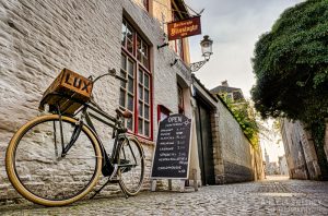 Café Vlissinghe with sign, lamp and classy bike, the oldest café in Brugge, Belgium