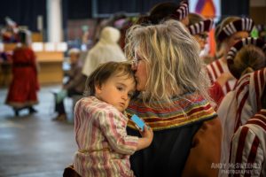 Intimate moment caught between mother and child during the rehearsal of the Holy Blood Procession in Brugge, Belgium 2015