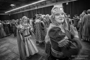 A black and white photo of dancing girls in costume practising their act at the rehearsal of the Holy Blood Procession in Brugge, Belgium 2015