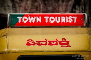 Riksja sign in India saying "Town Tourist".