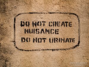 Wall sign in India saying "Do Not Cause Nuisance, Do Not Urinate"