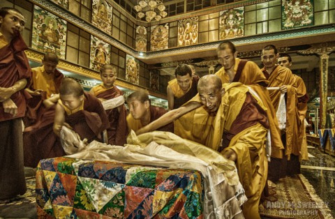 Colorful portrait of praying monks with kata during the funeral ceremony of His Holiness Penor Rinpoche in the monastery of Bylakuppe, South-India