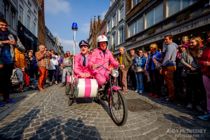 The Pink Police street performers doing their act during the Steenstraat Braderie in Brugge, Belgium 2015