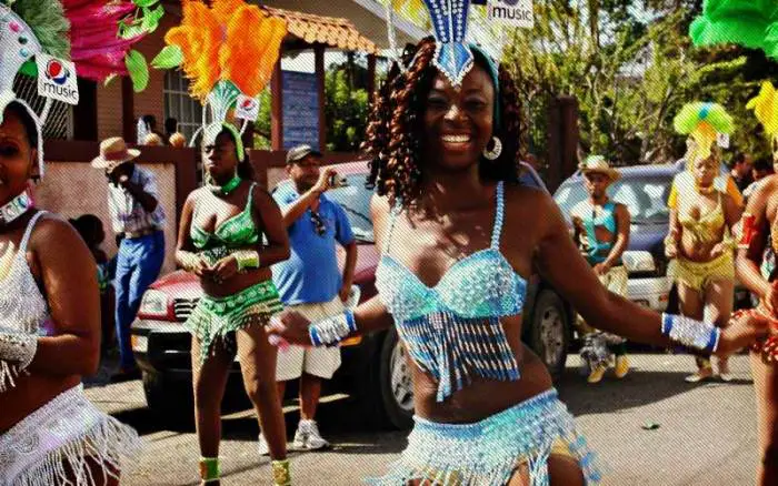 People take to the streets during carnival to celebrate in Limon