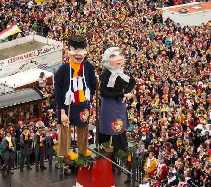 Carnival mascots stand in the main square during the Bolduque carnival