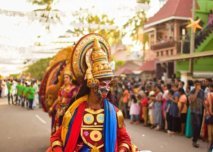 People attend the Cochin Carnival in traditional costumes or masquerade costume