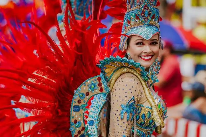 People wear amazing colorful costumes at the Aruban Carnival
