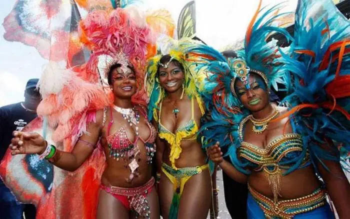 People wear colorful clothes at the Miami Broward Carnival
