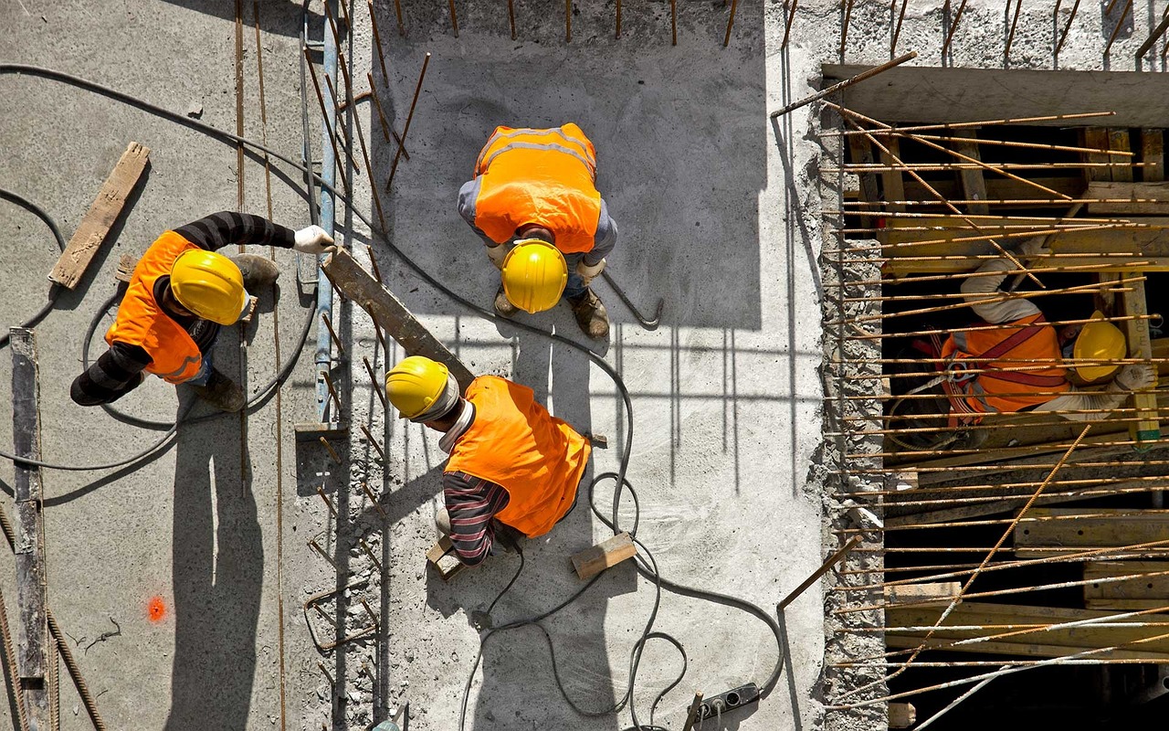 a group of construction workers working on a construction site