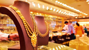 Gold and diamond jewellery displayed in a Kalyan Jewellers showroom