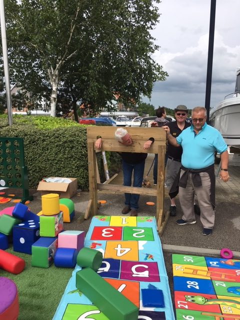 The Vice Commodore suffers the stocks - did anyone tickle his feet?