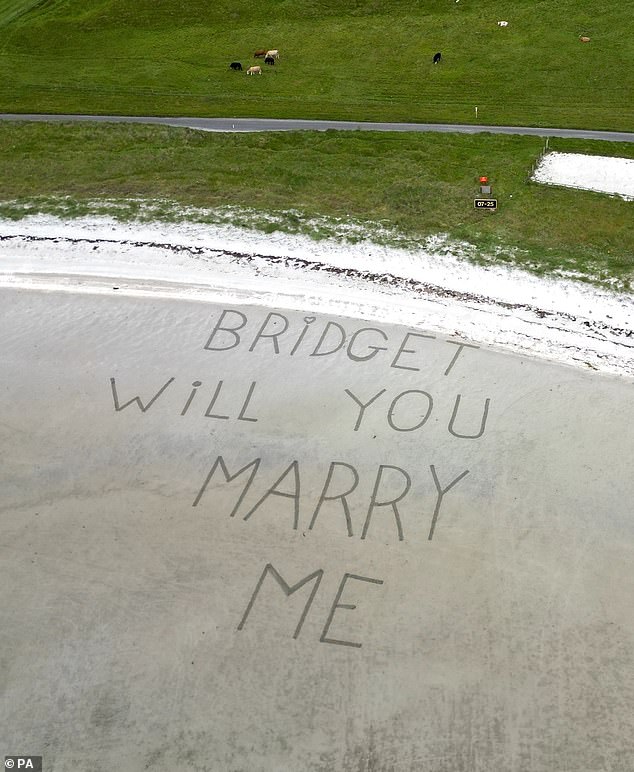 Enlisting the help of airport staff, Mr McCann had 'will you marry me?' etched into the sandy two-mile stretch