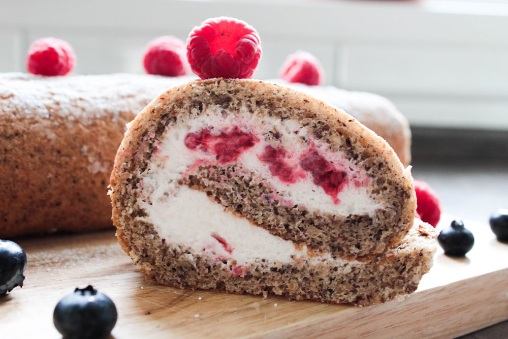 Hazelnut cake roll with raspberries