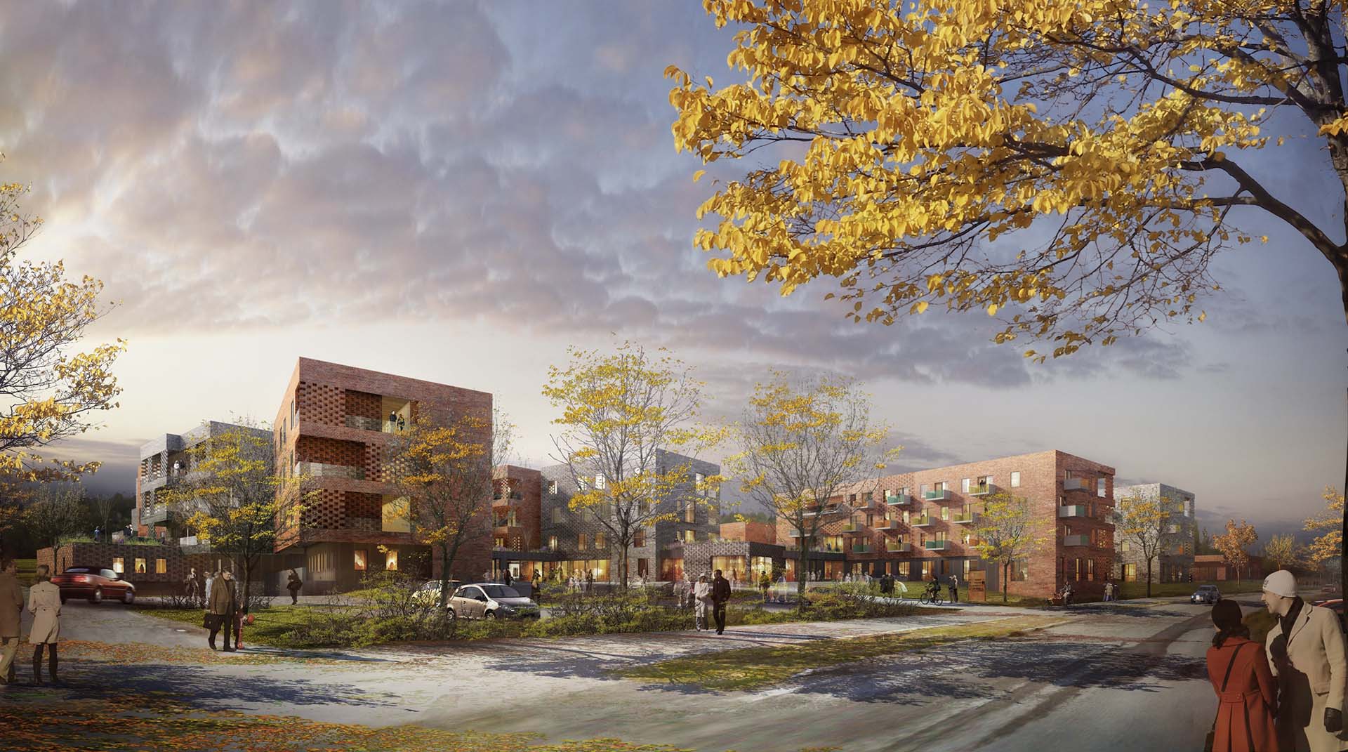 <strong>Alta Omsorgssenter</strong> – Competition Winner Exterior view of a Care Center in Alta, Norway, designed by Asas Arkitektur, showcasing modern residential buildings with red brick facades, large windows, and surrounding autumnal trees with people walking along the pathways under a dramatic evening sky.