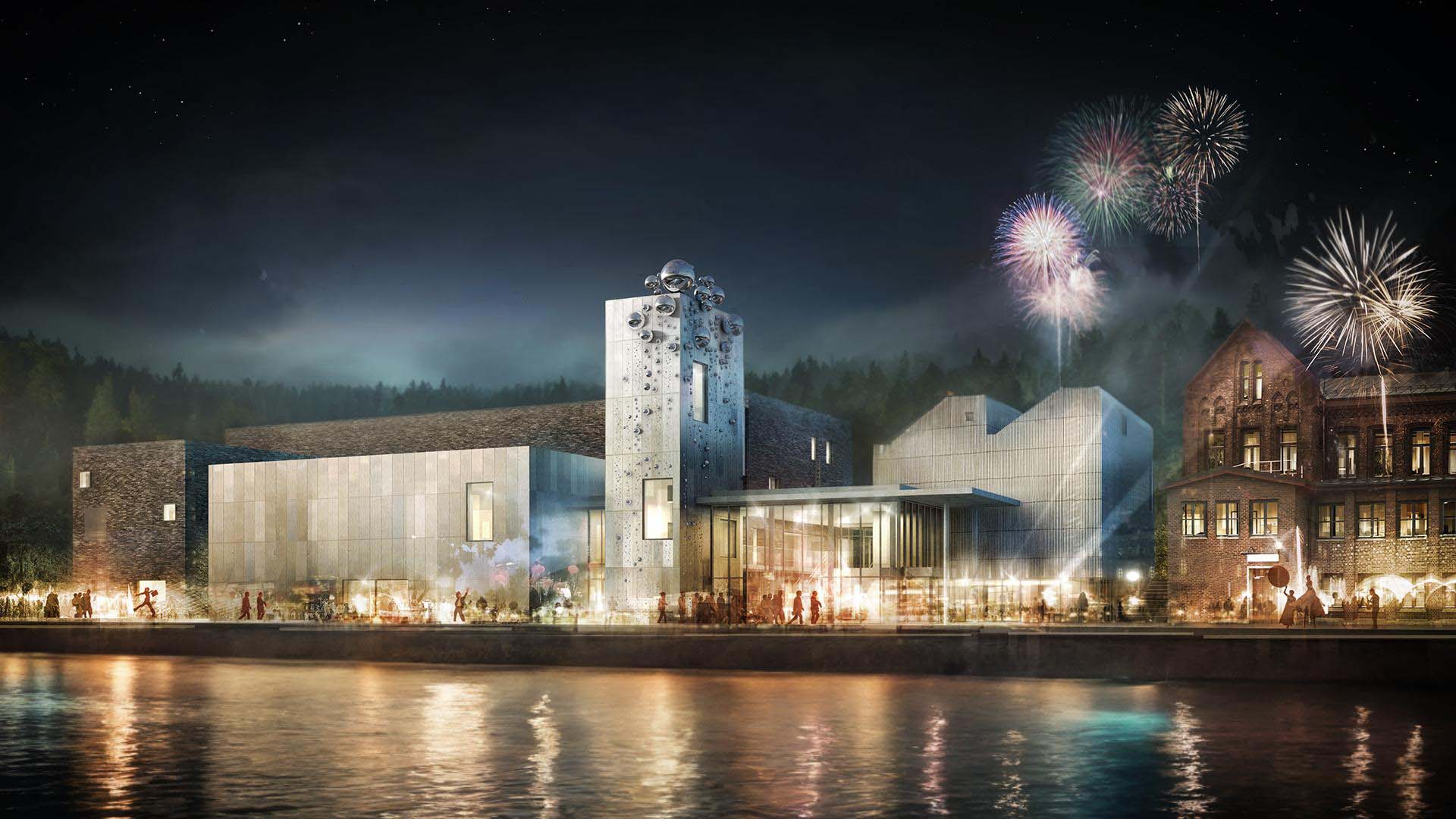 <strong>Porsgrunn Kulturhus</strong> Night exterior of the Cultural and Public Building in Porsgrunn Norway designed by Dyrvik Architects developed by Porsgrunn Municipality featuring illuminated architecture with fireworks and reflections on the water