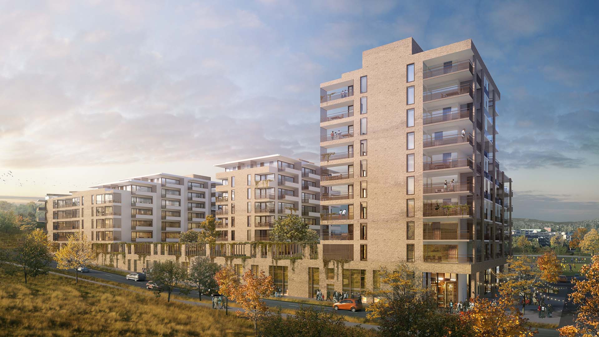 <strong>Rolvsrud Sports Park</strong> Exterior view of the Rolvsrud Sports Park residential development in Lørenskog, Norway, designed by HRTB AS Arkitekter, featuring modern mid-rise buildings with brick facades and large balconies, set in a landscaped urban environment.