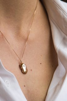 celine daoust rose gold scarab and triangle diamond necklace