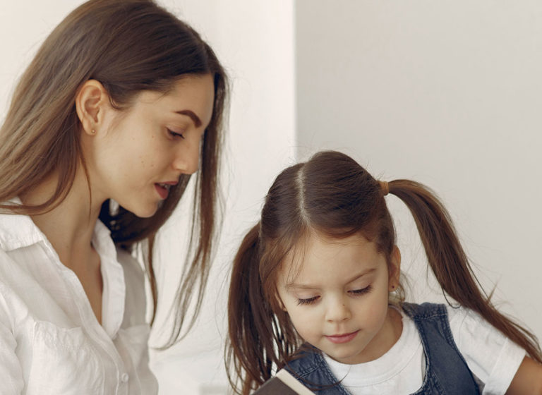 tutor-with-litthe-girl-studying-at-home