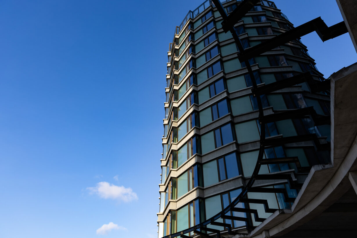 a tall building with a curved balcony