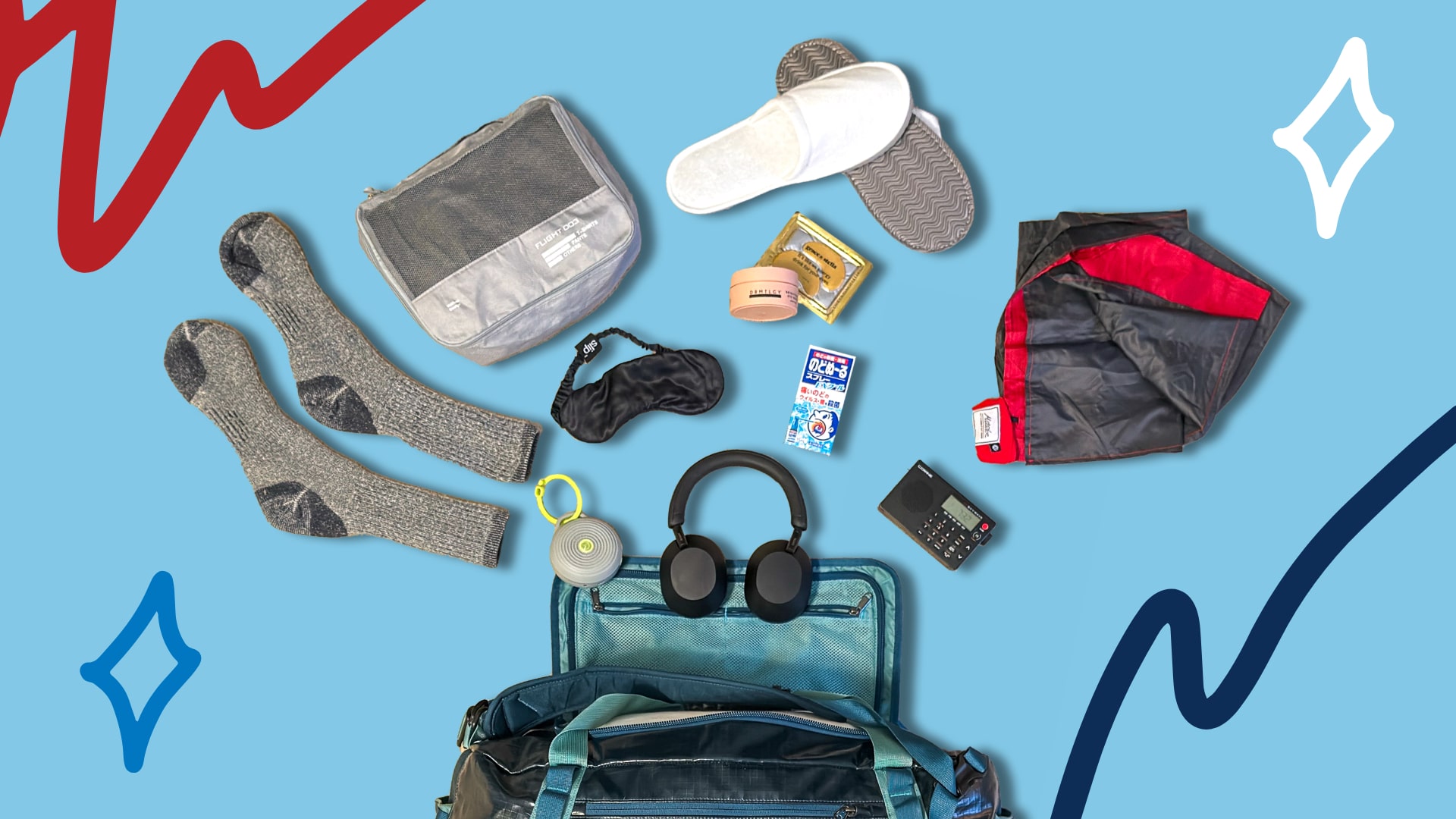 a selection of the best gifts for travelers arranged on a blue background