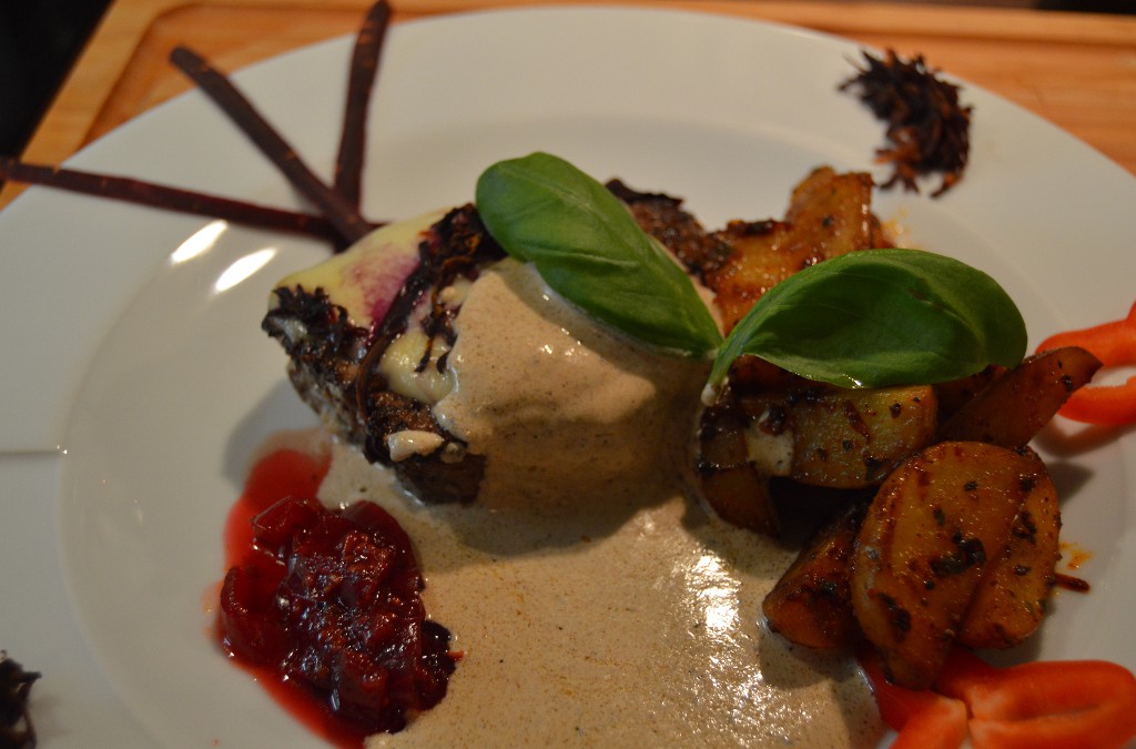 Mozzarella Steak with sauce and spicy potatoes.