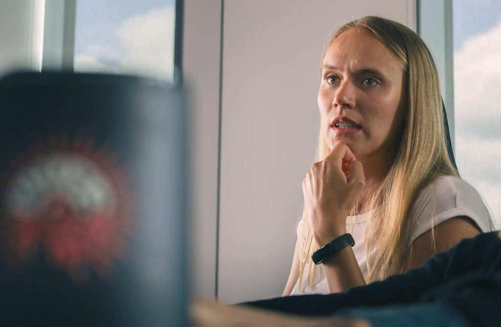 Environment Artist Evelina looking at a screen