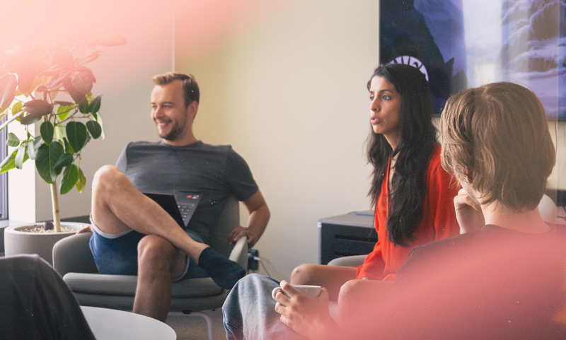 Three game developers in meeting room