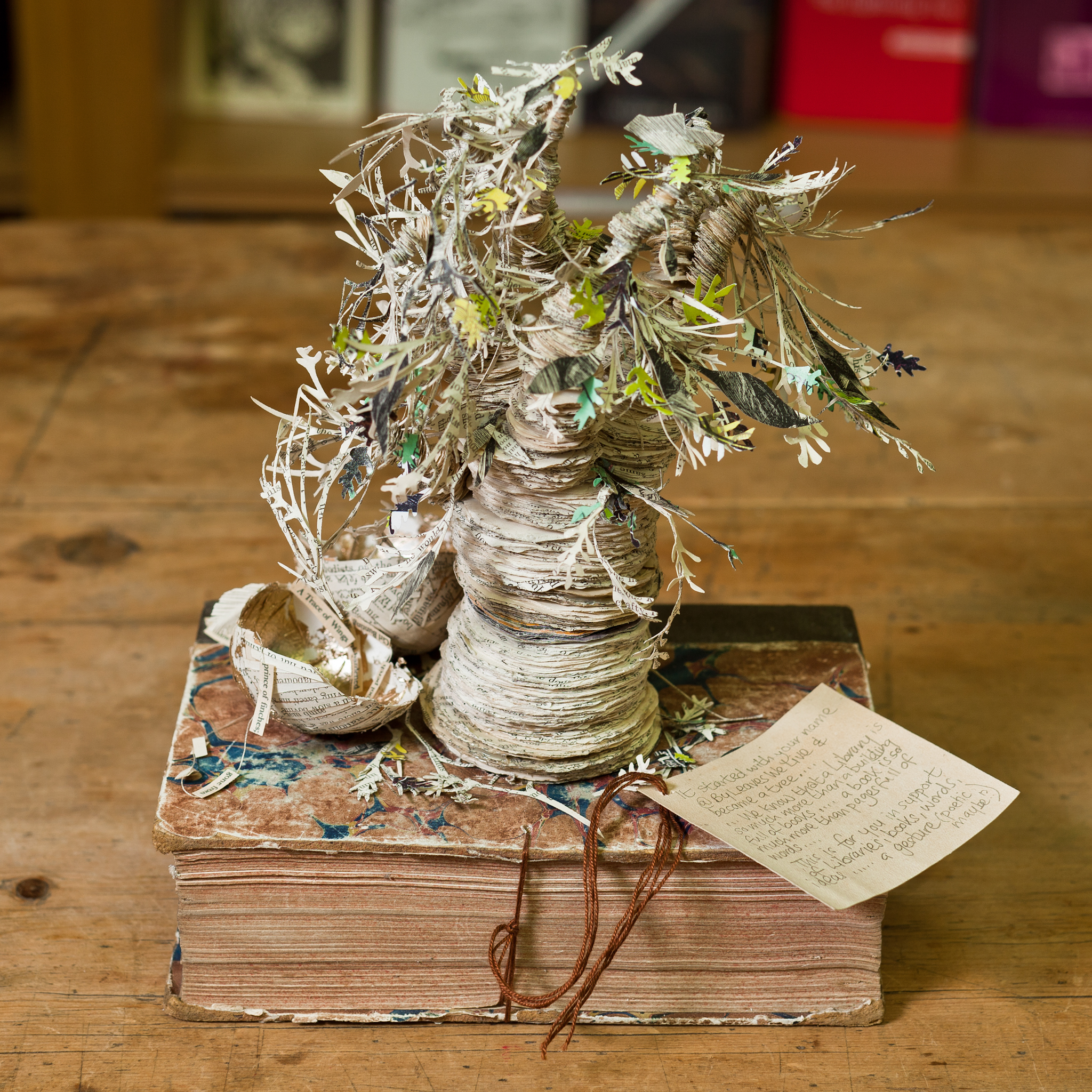 A sculpture made from a book in the shape of a tree