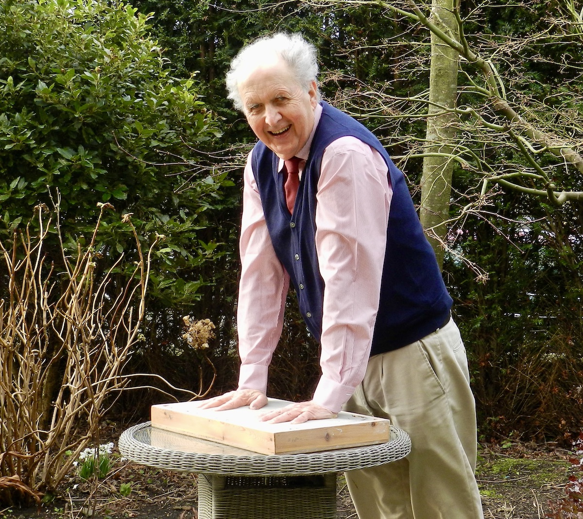 Alexander McCall Smith casting hands in clay