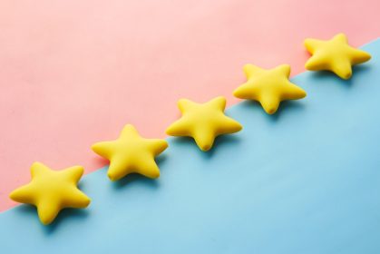 5 yellow stars on a blue and pink background