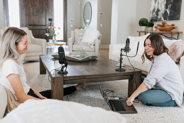 two people recording a podcast