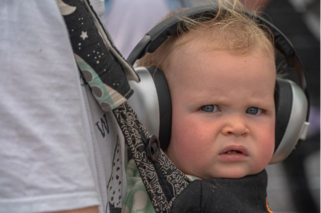baby frowning with headphones