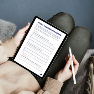 podcast launch planner displayed on tablet being held by person