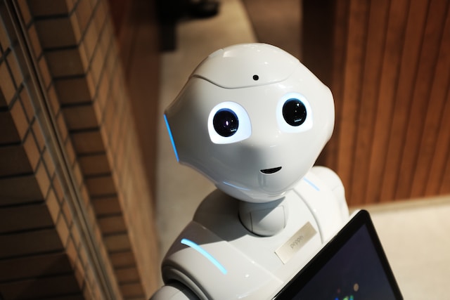 white ai robot next to brown wall