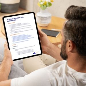 man sitting reading podcast episode titles framework on a tablet device