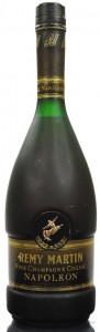 Black cap but also newer logo (observe distance left hand and tail and opening between front legs); content stated on lower right (difficult to see)