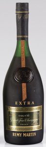 black cap and wax seal; text in three corners of the label