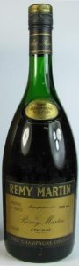 700ml stated bold on upper right, closer to text left of it; glass has a darker green colour